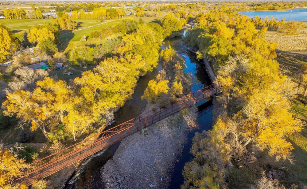 lions open space with bike trail over poudre river