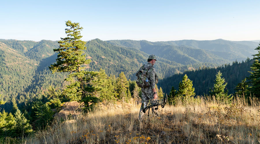 man hunting in mountains