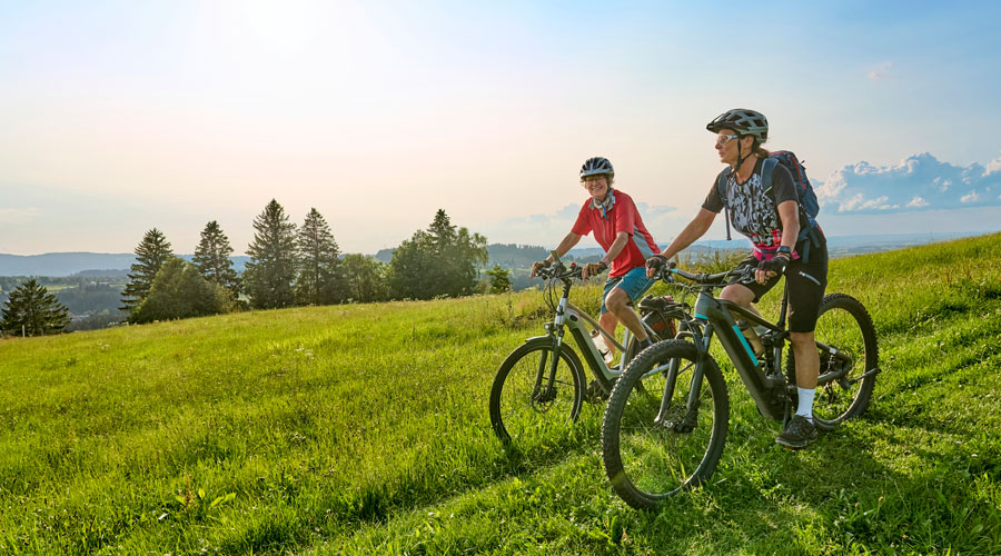 two women mountain biking